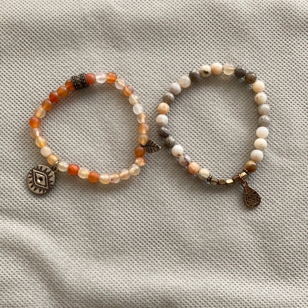 2 Bracelets, round marble and crystal beads with charms.